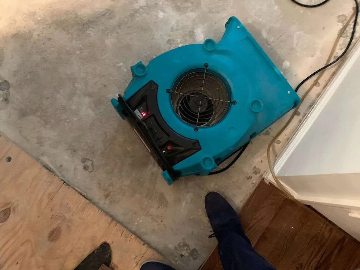 Air mover drying subfloor during Leak Detection & Repair in San Bruno